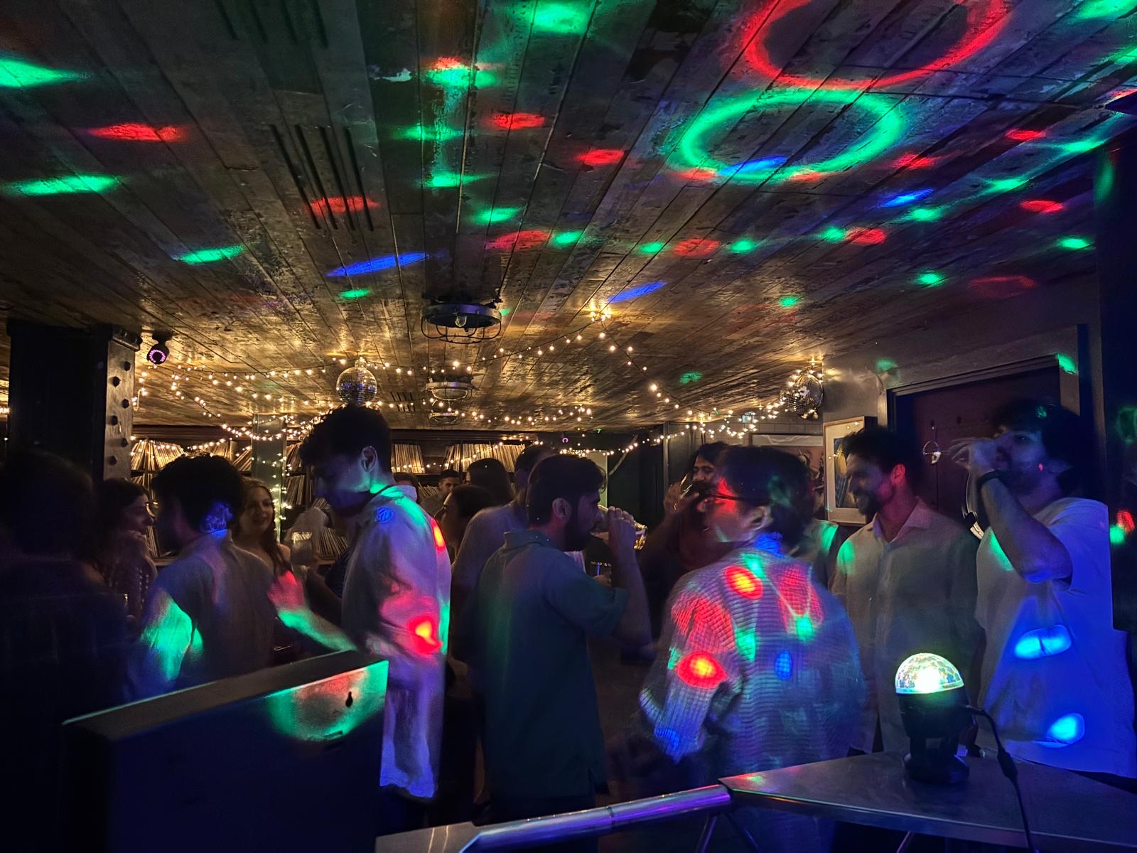Busy dancefloor with disco lighting